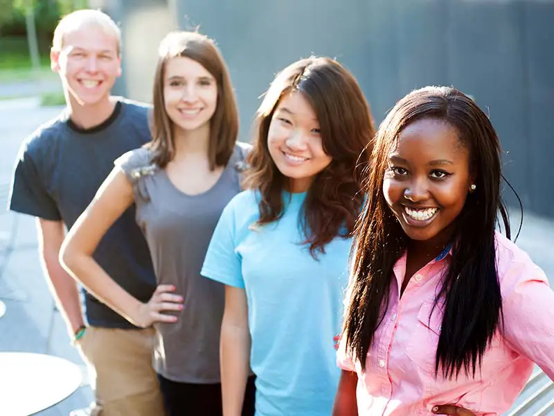 An image of a group of teenagers smiling.